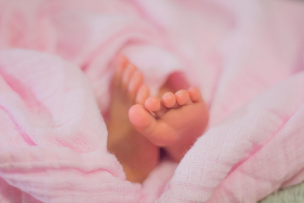 Newborn girls' feet